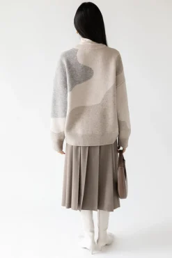MIDI PLEATED ASYMMETRICAL SKIRT