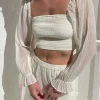 SMOCKED RUFFLE SLEEVE BLOUSE