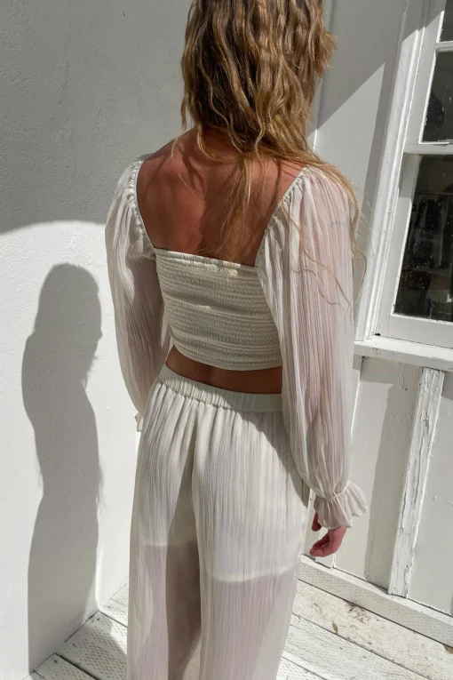 SMOCKED RUFFLE SLEEVE BLOUSE