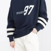 VARSITY GRAPHIC JERSEY SWEATSHIRT